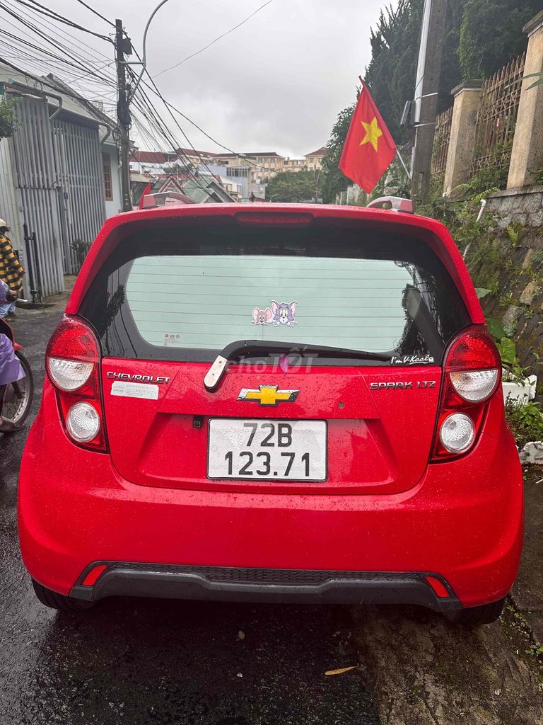 Фото 2: Chevrolet Spark 2013 автоматическая 90000 км красный