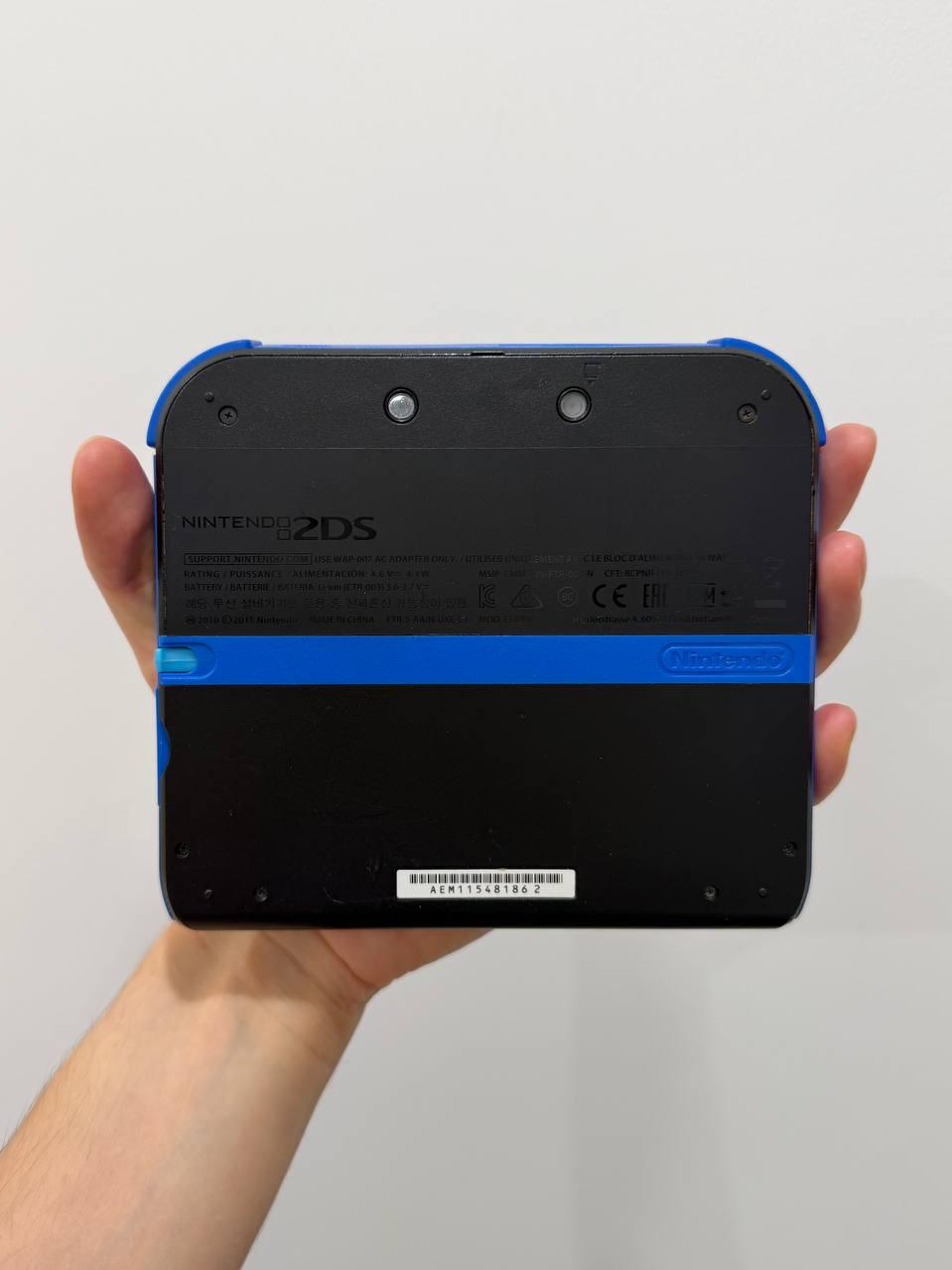 Фото 2: Продается портативная игровая консоль Nintendo 2DS в хорошем состоянии.